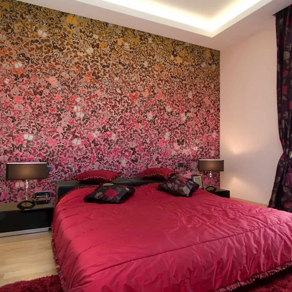 Fototapet Et hav af sommerfugle i røde og gule farver